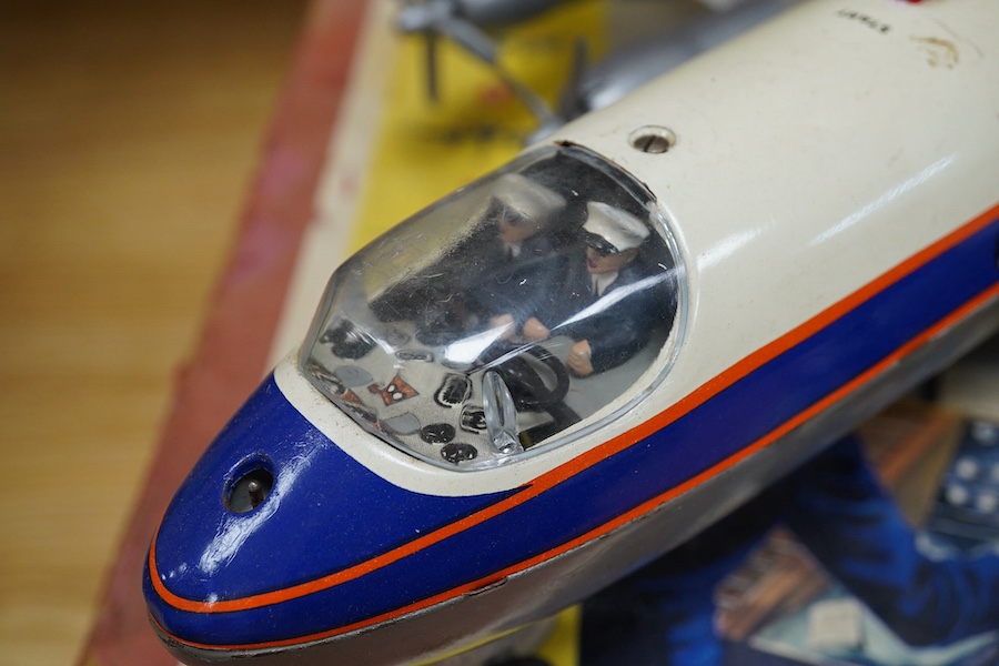 A boxed Schuco Elektro Radiant 5600 battery operated tinplate BOAC passenger aircraft, with instruction leaflet and steering wheel. Condition - poor to good, wear and damage to box and some tape repairs, aircraft general